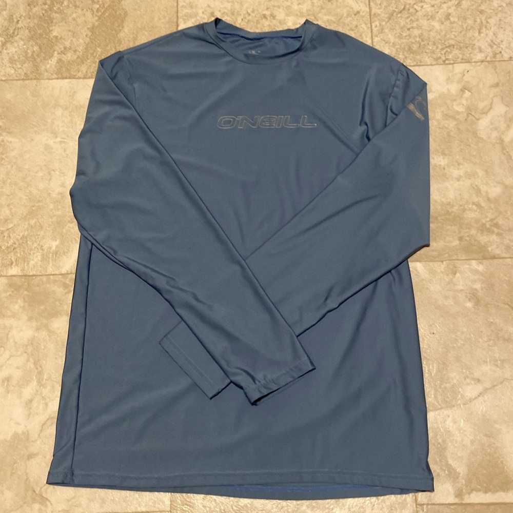 Like new corn blue O’Neill rash guard, size XL slim fit